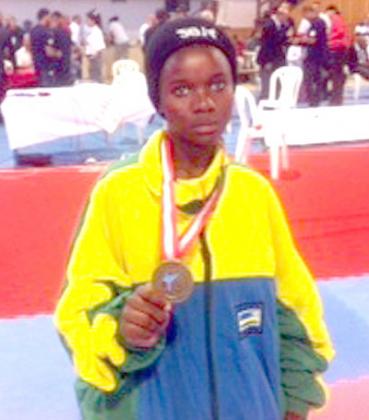 Aisha Umuhoza shows off her medal in Tunis. Times Sport / Courtesy.