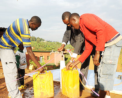 Kigali residents buy water stored in a u2018bladderu2019 reservoir. The New Times/File