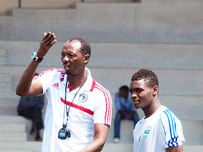 Coach Eric Nshimiyimana with striker Emmanuel Sebanani. Times Sport/T. Kisambira