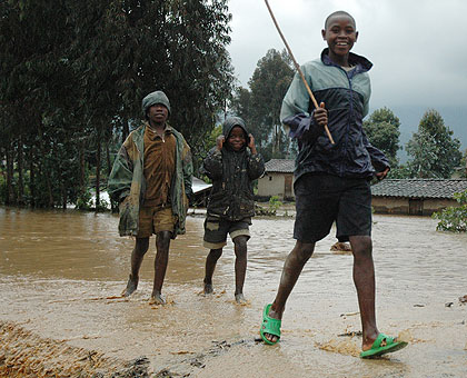 Children play after heavy rains in the Northern Province. Rwanda, like other countries world over, is experiencing floods and other natural catastrophes due to climate change. The ....