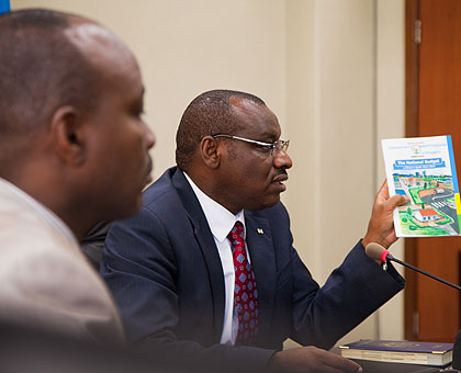 Minister Gatete and  Bayingana (L) at the launch of u2018The National Budget: A citizenu2019s guide 2013-2014u2019 booklet yesterday. The New Times/ Timothy Kisambira.  