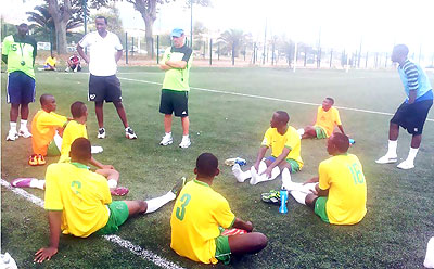 Richard Tardy (in cap) talking to his players after a training session in Nice, France recently. Times Sport / Courtesy.