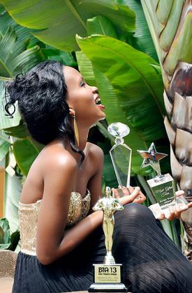 A smile of a winner. Gashumba shows off one of her awards. The New Times/Courtesy