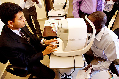 An optician checks a patientu2019s eye at Dr Agarwalu2019s Eye Hospital in Remera.   The New Times/ T. Kisambira.
