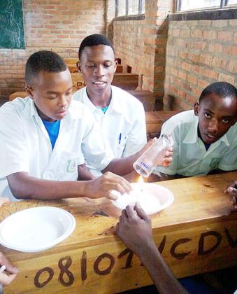 Students practice carrying out experiments during the Science and Technology Day last week.   The New Times/ Courtesy.