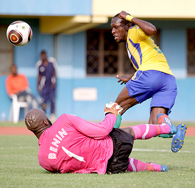 Meddie Kagere tries an audacious chip over Benin keeper during a 2014 Fifa World Cup qualifier at Amahoro stadium. Times Sport / File.