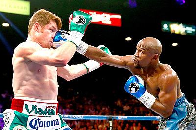 Mayweather (R) badly mistreated Saul 'Canelo' Alvarez (L) in the sport's biggest event in years.  Net photo