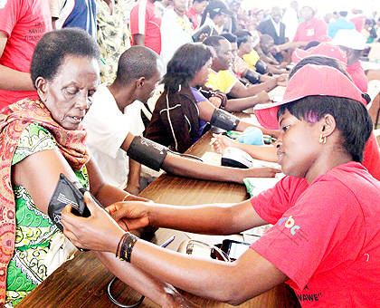 An elderly woman checks for high blood pressure during the tests at the launch of the campaign against non-communicable diseases at Petit Stade in Remera.The New Times/ John Mbanda.