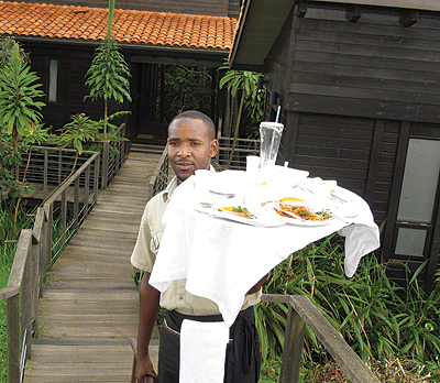 A Nyungwe Forest Lodge worker does what he knows best. The facility has top notch service.