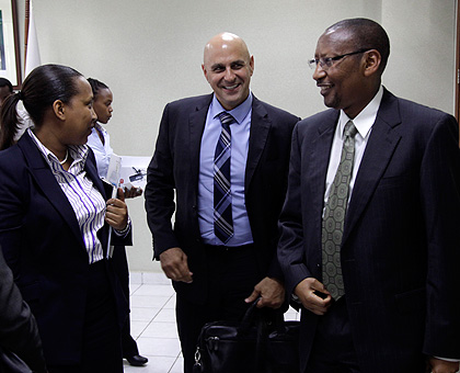 L-R: Ministry of Finance Permanent Secretary and Secretary to the Treasury, Pichette Sayinzoga Kampeta, IMF team leader Paulo Drummond and central bank governor John Rwangombwa aft....