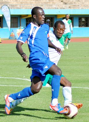Rayon Sports midfielder Aphrodis u2018Kanombeu2019 Hategekimana  battles with a SC Kiyovu defender in a second round league clash at Amahoro stadium. Saturday Sport/ P. Muzogeye