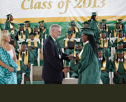 Gashora Girls Academy of Science and Technology headteacher Peter Thorp hands over certificates to the graduates yesterday as co-founder McGill looks on.    Saturday Times/ Timothy....