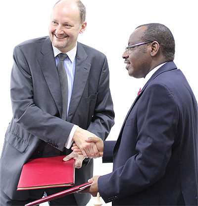 Minister Gatete and Ambassador  Arrion after signing the deal yesterday.   Saturday Times/ Courtesy photo. 