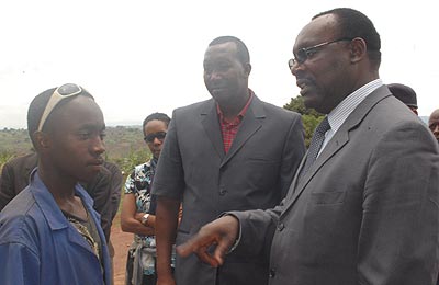 Kanimba (R) talks to a teenager who has benefited from Hanga Umurimo in Gisagara District.   The New Times/Jean Pierre Bucyensenge