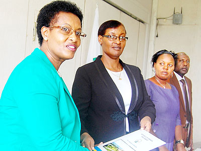 Mukarurangwa (L) hands over to Speaker Mukabalisa as her deputies; Uwimanimpaye and Mukama look on. The New Times/Courtesy