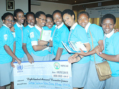Nyundo school debate team pose with their dummy cheque after they emerged winners. The New Times/Ambroise Agaba