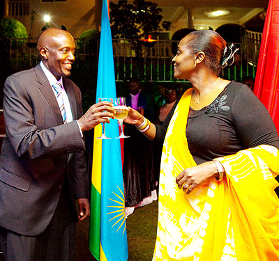 Amb. Kabonero (L) in a toast with Baine on Wednesday. The New Times/ T. Kisambira