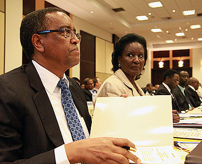 Infrastructure Minister Lwakabamba (L) and Ugandau2019s Trade Minister Kyambadde during the  Rwanda-Uganda Business forum yesterday.    Saturday Times/  John Mbanda. 
