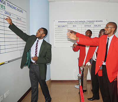 Stock brokers during a trading session early this year. Uchumi joins the local bourse today.
