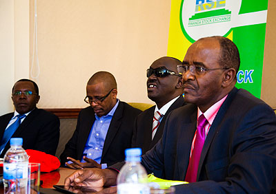 Lu2013R, Mathu, David Mataen Faida, the securities transaction advisor, Ndahiro and Ciano address reporters after the corss-listing of Uchumi. The New Times / Timothy Kisambira