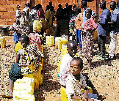Some city residents at times spend hours queueing to access water. The New Times / File photo