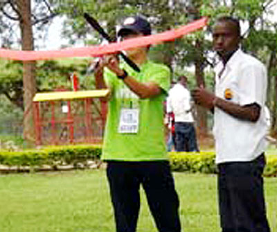 Students attempt to fly a model plane during the competition. The New Times/ S. Babijja