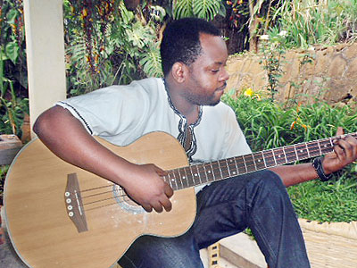 Bac-T plays his guitar. Sunday Times/Moses Opobo