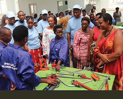 IPRC Kigali female students exhibit their techincal skills before Minister  Gasinzigwa (R).   The New Times/Sarah Kwihangana.