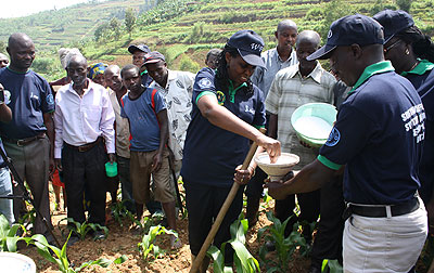 Minister Kalibata with some farmers during the World Food Day on Friday in Ngororero District.   The New Times/ Susan Babijja. 