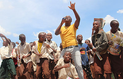 School children join King James on stage.The New Times / Sarah Kwihangana .