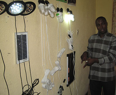 A GVEP renewable energy sourcesu2019 expert demostrating how solar energy products work.    The New Times / Courtesy photo