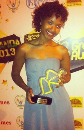 Gloria Uwamahoro poses with her prize as the New Artiste of The Year during the 2013 Groove awards.The New Times /  Collins Mwai