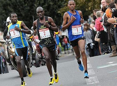 Disi (L) racing past Kenyan pair of Stephen Ogari (C) and Jvens Kosgei (R) in the Coulu00e9e Verte half marathon. Times Sport / Courtesy