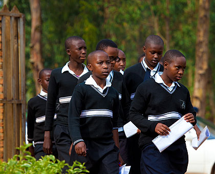 Pupils of Rwamagana Primary School walk towards the examination room in Rwamagana District yesterday morning. Up to 174,874 candidates started Primary leaving exams across the country.  The New Times/ Timothy Kisambira. 
