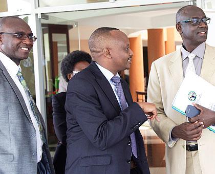 Justice Minister Johnston Busingye (R) chats with Prosecutor General Richard Muhumuza as Prosecutor Secretary General Jean-Damascu00e8ne Habimana looks on. Sunday Times/John Mbanda