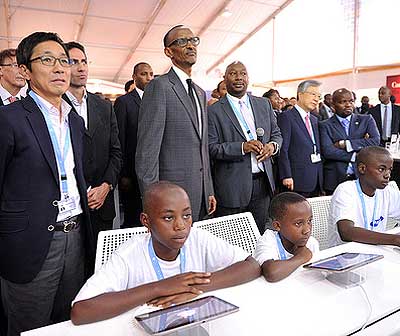 President Kagame and other delegates during an ICT demonstration yesterday. 