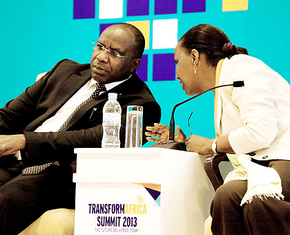 Premier Habumuremyi consults with CEO, Rwanda Development Board, Valentine Rugwabiza at the closure of the four-day Transform Africa Summit 2013 in Kigali yesterday. The New Times/ Timothy Kisambira.