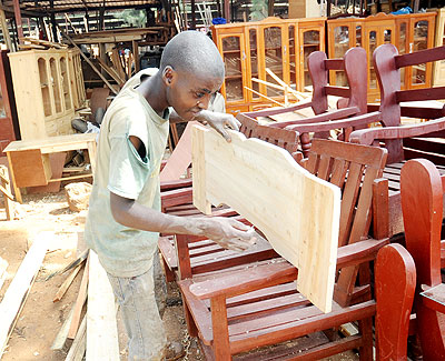 A youth works at a carpentry workshop. Visiting German experts have tipped vocational training centres on skills that can market their potentials.  The New Times/ File.