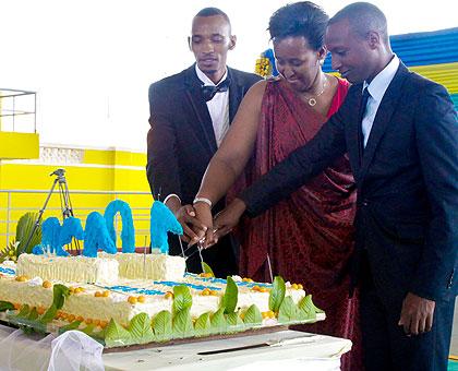 L-R President of GAERG, Charles Habonimana, First Lady Mrs. Jeannette Kagame, and  President of AERG Constantin Rukundo cutting a cake. The New Times/T.Kisambira