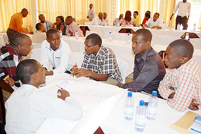 Some of the medical practitioners deliberate during the seminar. The New Times/ JP Bucyensenge.