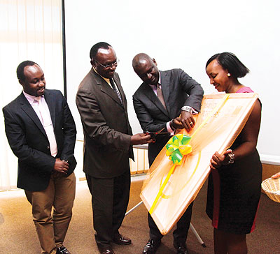 Minister Kanimba (second left) cuts the ribbon to launch the export forum as Mining State Minister Evode Imena looks on. Second right, is PSF chairman Gasamagera. The New Times / John Mbanda