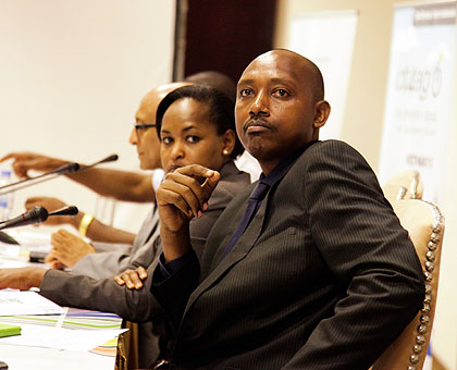 Ernest Ruzindaza (R), the Permanent Secretary in  the Ministry for Agriculture, together with his ICT and Youth counterpart Rosemary Mbabazi, listen to a presentation during the ICT for Agricultural Summit in Kigali yesterday . The New Times/Timothy Kisambira. 