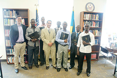 Hawley (L) poses with the teachers. The New Times/ Courtesy.