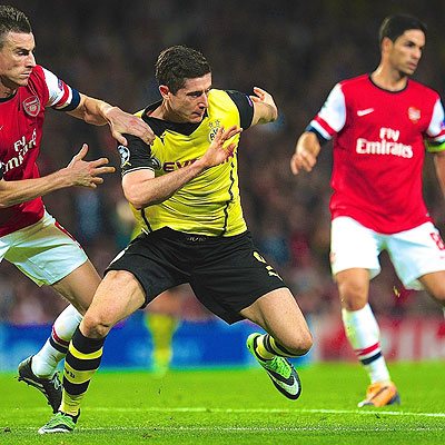 Arsenal defenders will have to be on top of their game to stop in-form Dortmund striker Robert Lewandowski. Net photo.