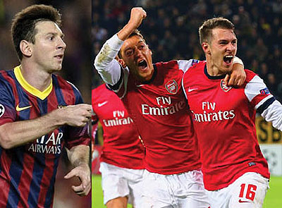 Leo Messi scored twice in Barca win.Ramsey and Ozil run over to the travelling support to celebrate. Net photo.