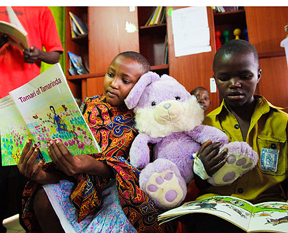 Some of the patients read books (above) and below, take part in a drawing exercise.  The New Times/ T.  Kisambira.