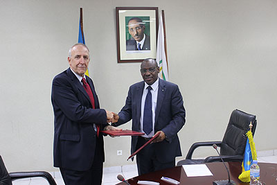 Amb. Gatete and the head of DFID in Rwanda, Mike Hammond after signing the MoU yesterday.  The New Times/ Courtsey. 