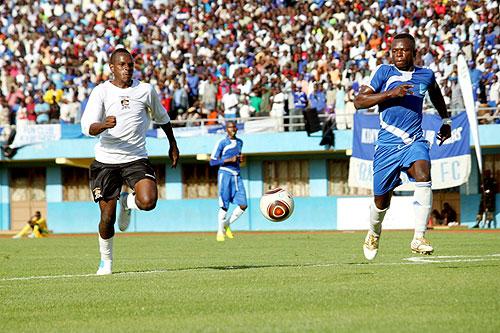 Charles Tibingana tries to dribble past Rayon Sports defender Hussein Sibomana. He scored the lone goal of the game. Sunday Sport/P. Muzogeye