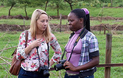 Dr Norridge (L) with one of the trainees during a photo shooting session.   The New Times/  Brendan Bannon. 