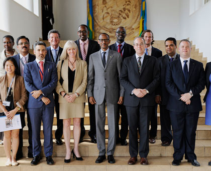 President Paul Kagame (C) poses for a photo with members of the Young Presidentsu2019 Organization yesterday. The New Times/Village Urugwiro